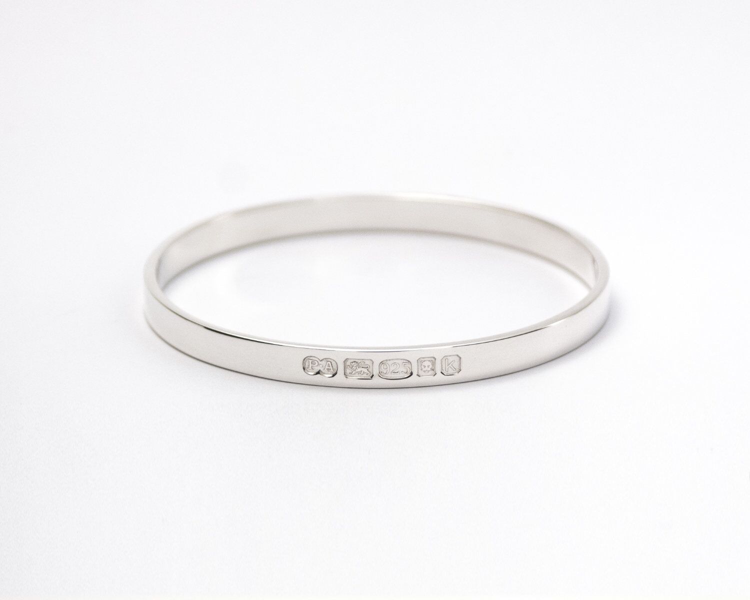 Zennor Solid Sterling Silver Bangle Outside Hallmarks 3 Zennor Solid Sterling Silver Bangle handmade in Cornwall. Solid Silver bracelet. London Hallmarks on the outside - 6mm wide.