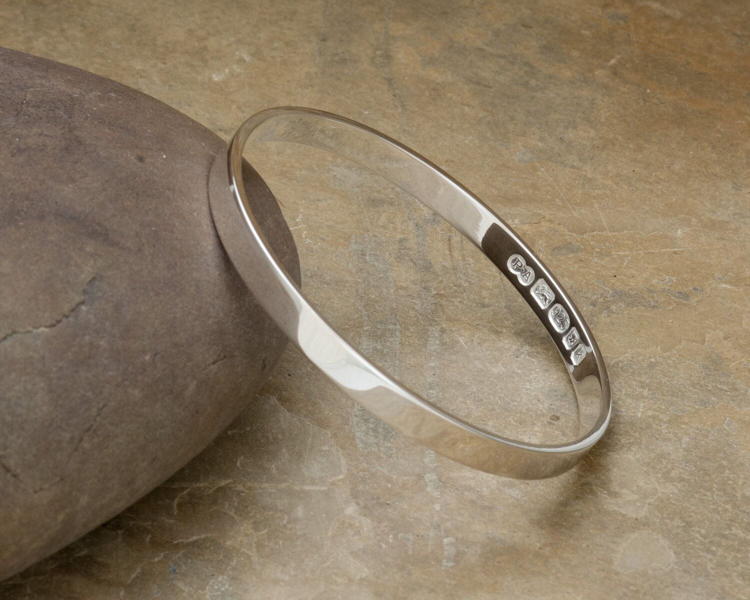 Zennor Solid Sterling Silver Bangle Inside Hallmarks 1 Zennor Solid Silver Bangle handmade in Cornwall. Solid Silver bracelet with display London Hallmarks - 6mm wide.