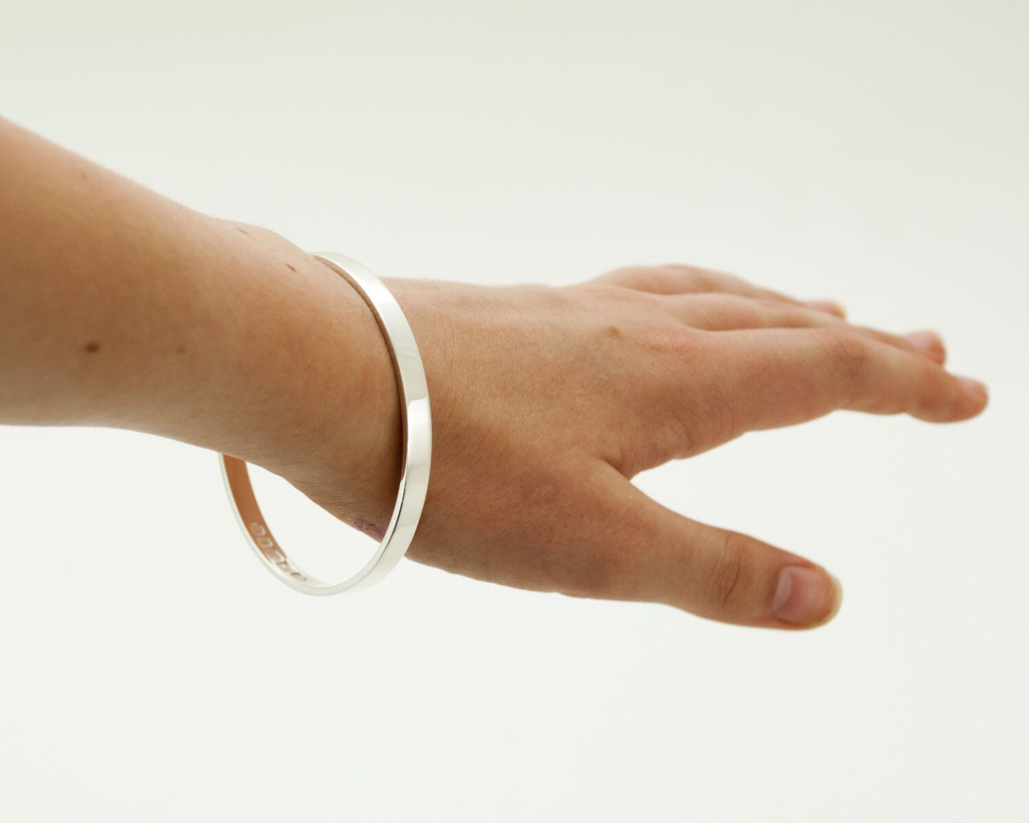 Zennor Solid Sterling Silver Bangle Inside Hallmarks 2 Zennor Solid Silver Bangle handmade in Cornwall. Solid Silver bracelet with display London Hallmarks - 6mm wide.