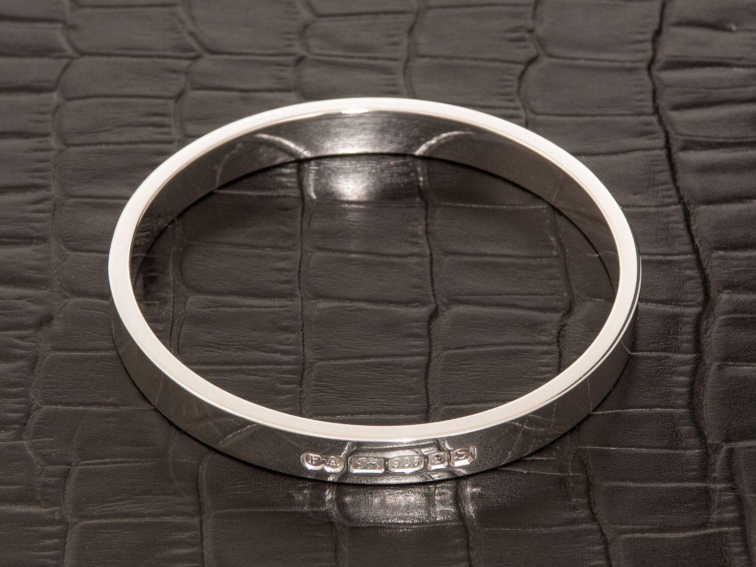 Zennor 8 Chunky Solid Sterling Silver Bangle Outside Hallmarks 5 Zennor 8 Chunky Solid Silver Bangle Bracelet, it is Handmade with outside display London Hallmarks - 8mm wide.