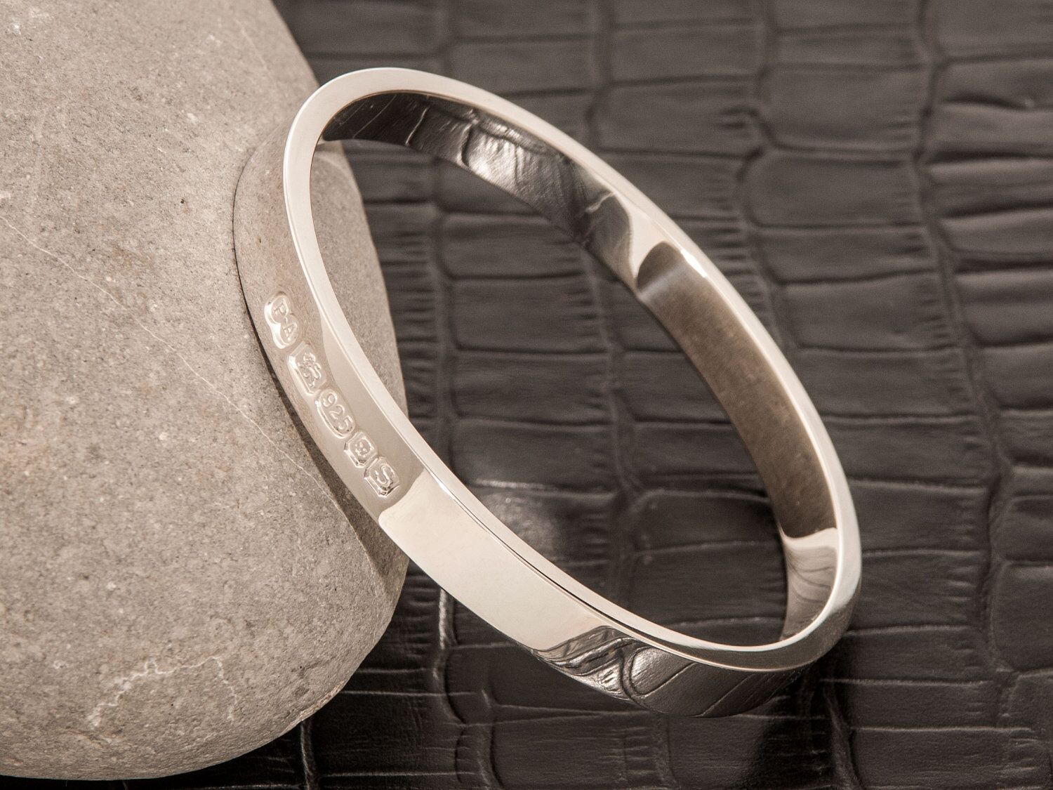 Zennor 8 Chunky Solid Sterling Silver Bangle Outside Hallmarks 1 Zennor 8 Chunky Solid Silver Bangle Bracelet, it is Handmade with outside display London Hallmarks - 8mm wide.