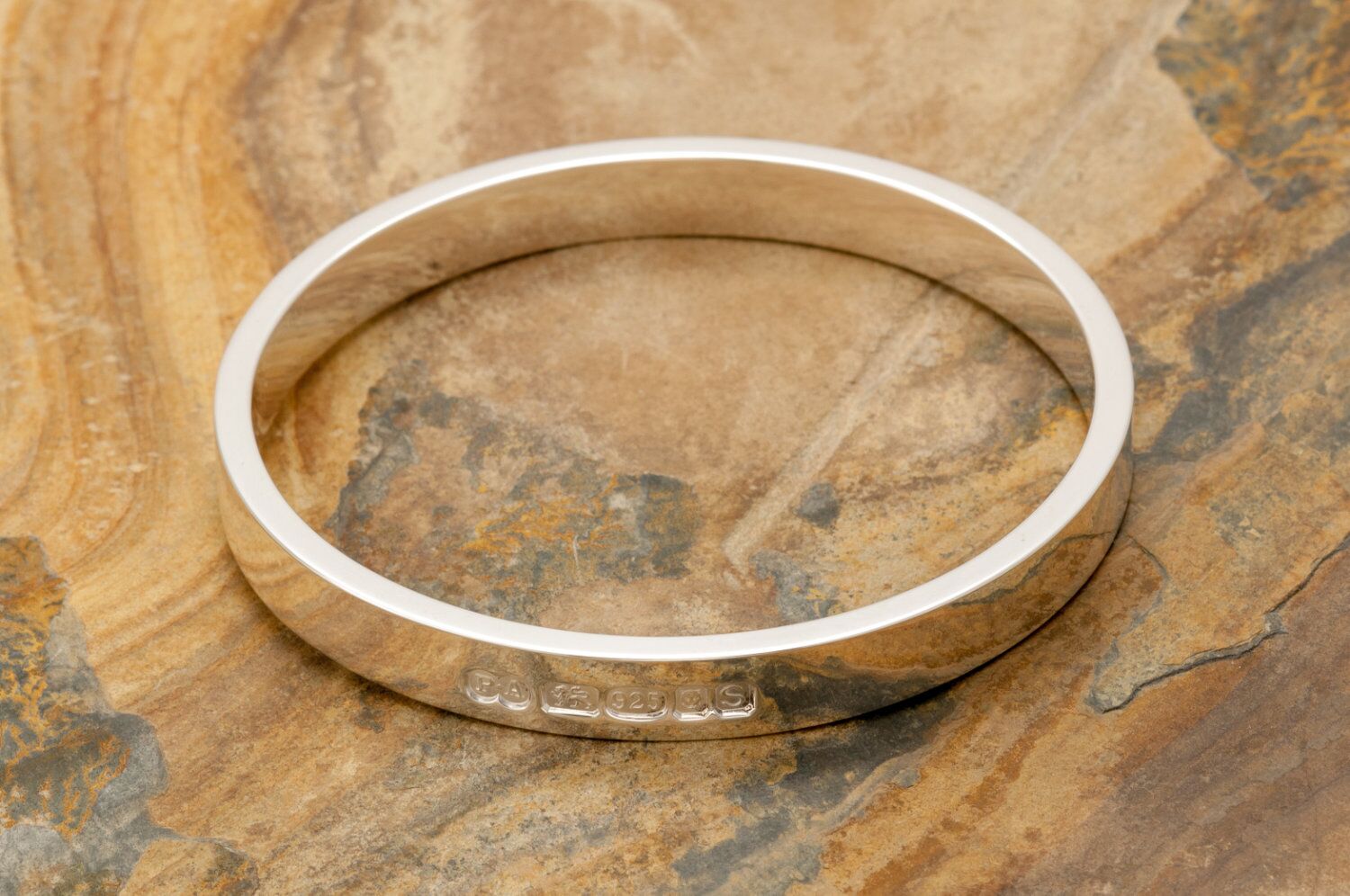 Zennor 8 Chunky Solid Sterling Silver Bangle Outside Hallmarks 4 Zennor 8 Chunky Solid Silver Bangle Bracelet, it is Handmade with outside display London Hallmarks - 8mm wide.