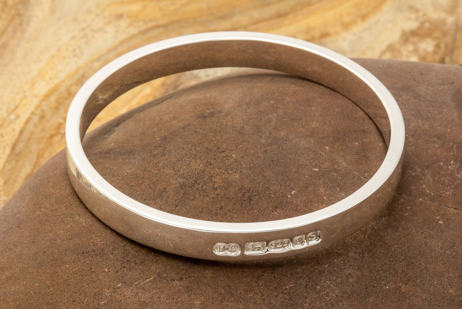 Zennor 8 Chunky Solid Sterling Silver Bangle Outside Hallmarks 2 Zennor 8 Chunky Solid Silver Bangle Bracelet, it is Handmade with outside display London Hallmarks - 8mm wide.