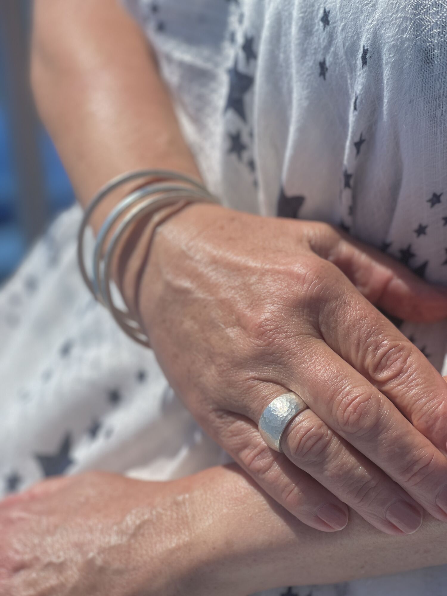 The Pebble Chunky Wide Hammered Sterling Silver Ring 2 Hand Model Wearing The Pebble Chunky Wide Hammered Sterling Silver Ring Handmade in Cornwall, London Hallmarked