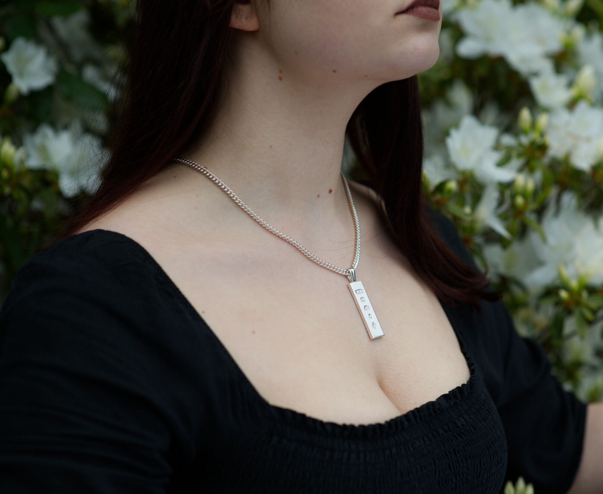 Solid Sterling Silver Millennium Ingot Pendant 2 Solid Silver Millenium ingot, london hallmarked being worn on a silver chain by a woman by kerensa Jewellery