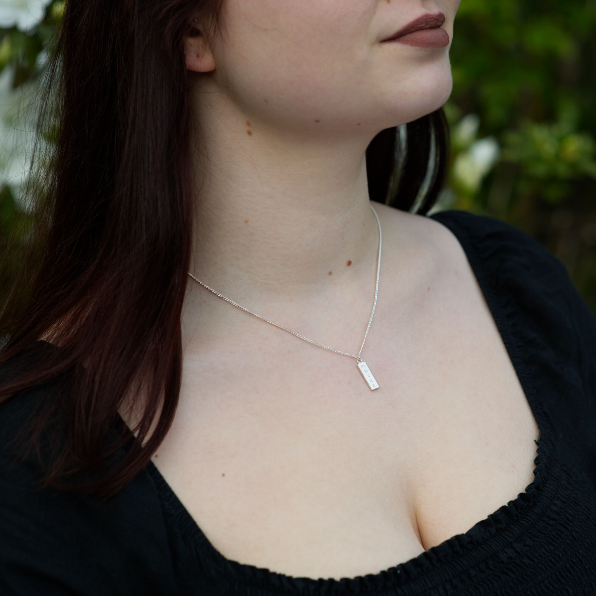 Solid Silver Millennium Ingot Pendant & Chain - Small 2 small Pendant Solid Silver millennium ingot, london hallmarked being worn on a silver chain by a woman by kerensa jewelery