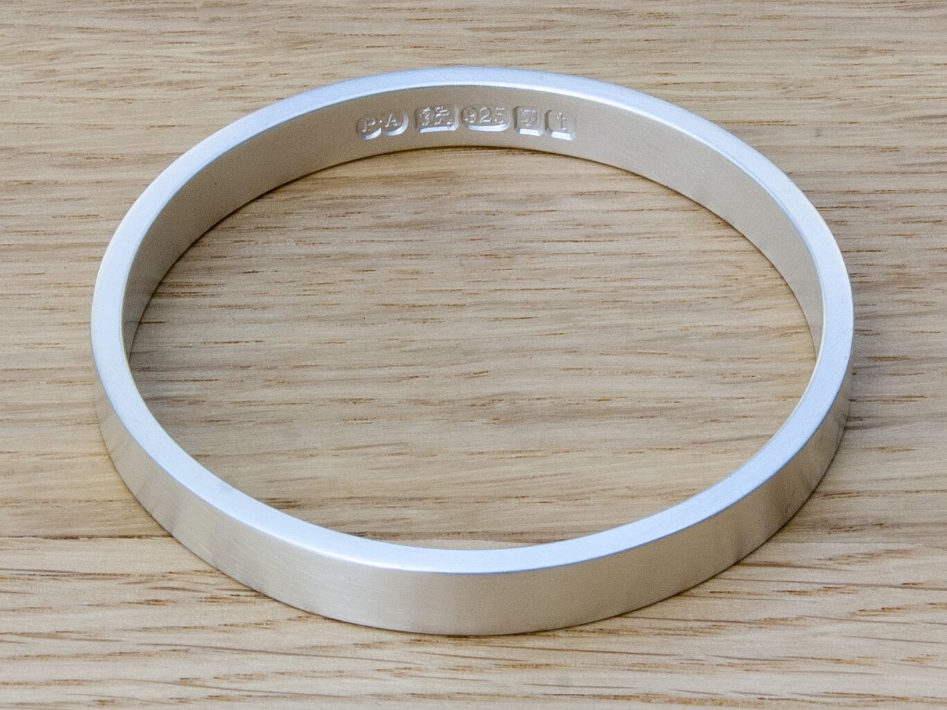 Zennor 8 Chunky Solid Sterling Silver Bangle Inside Hallmarks 1 Zennor 8 Chunky Solid Silver Bangle Bracelet, it is Handmade with outside display London Hallmarks - 8mm wide.